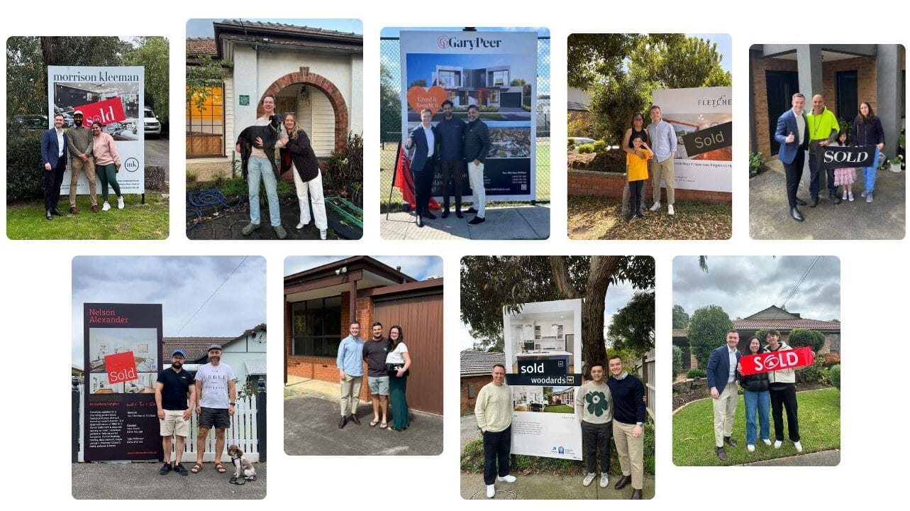 Three people stand beside a real estate sign with a large Sold tag in front of a yard.